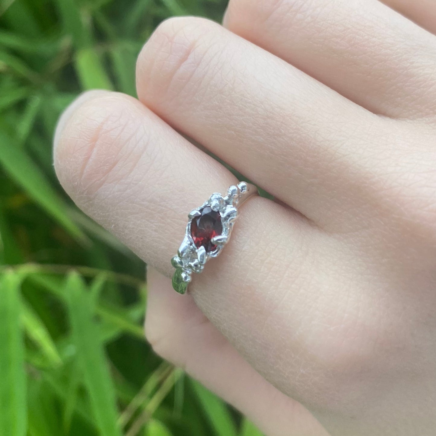 Sterling silver garnet ring on model