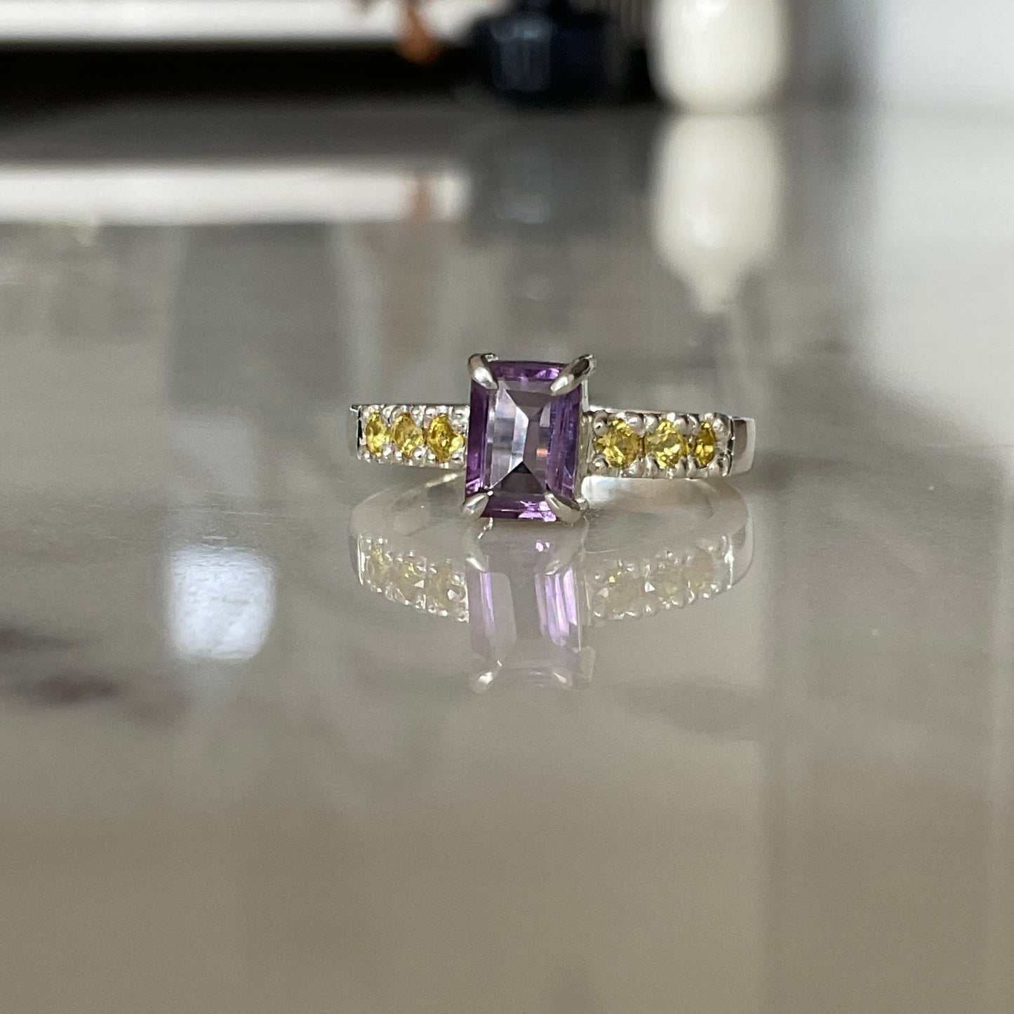 Sterling silver amethyst ring with yellow sapphires set into the ring band