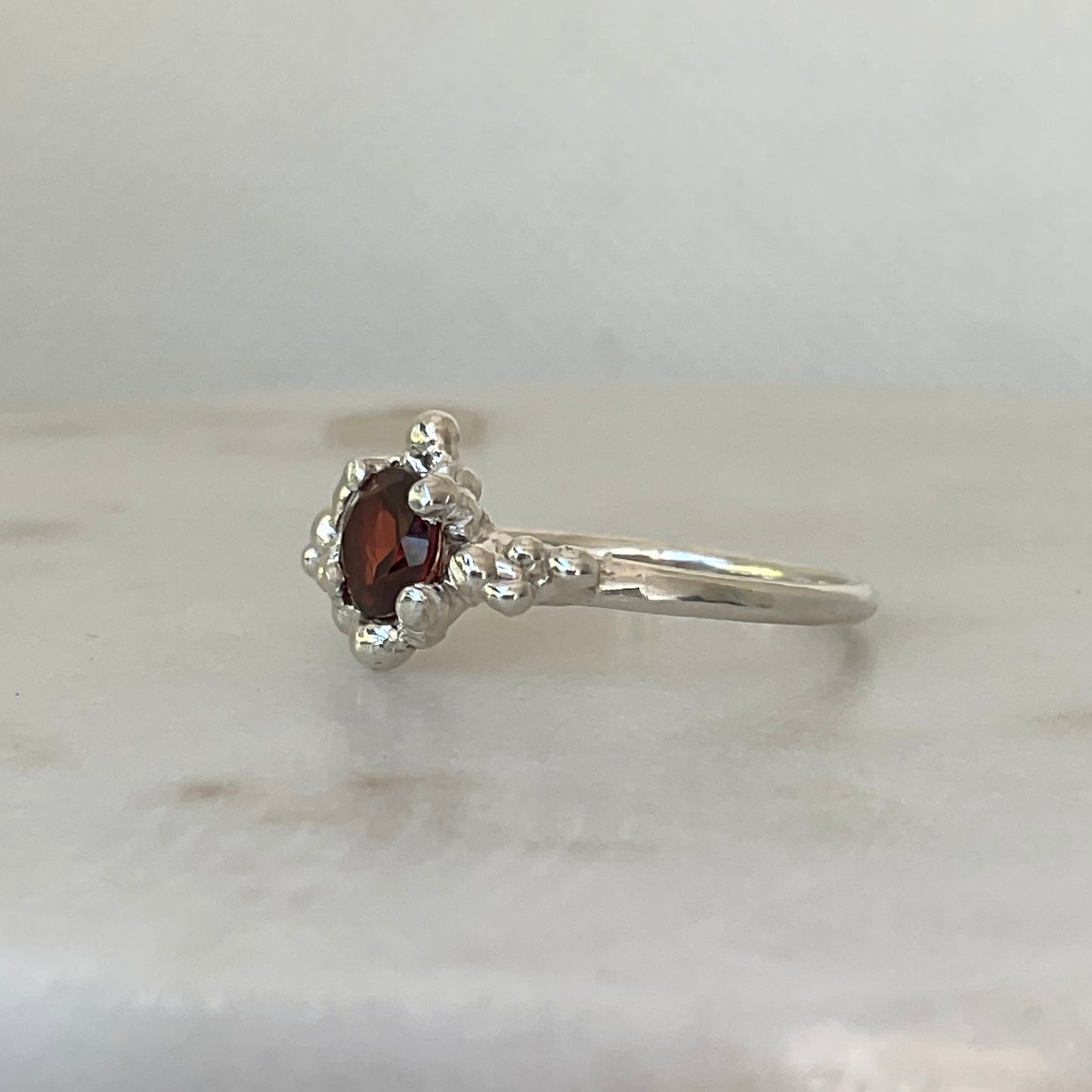Side view of garnet ring