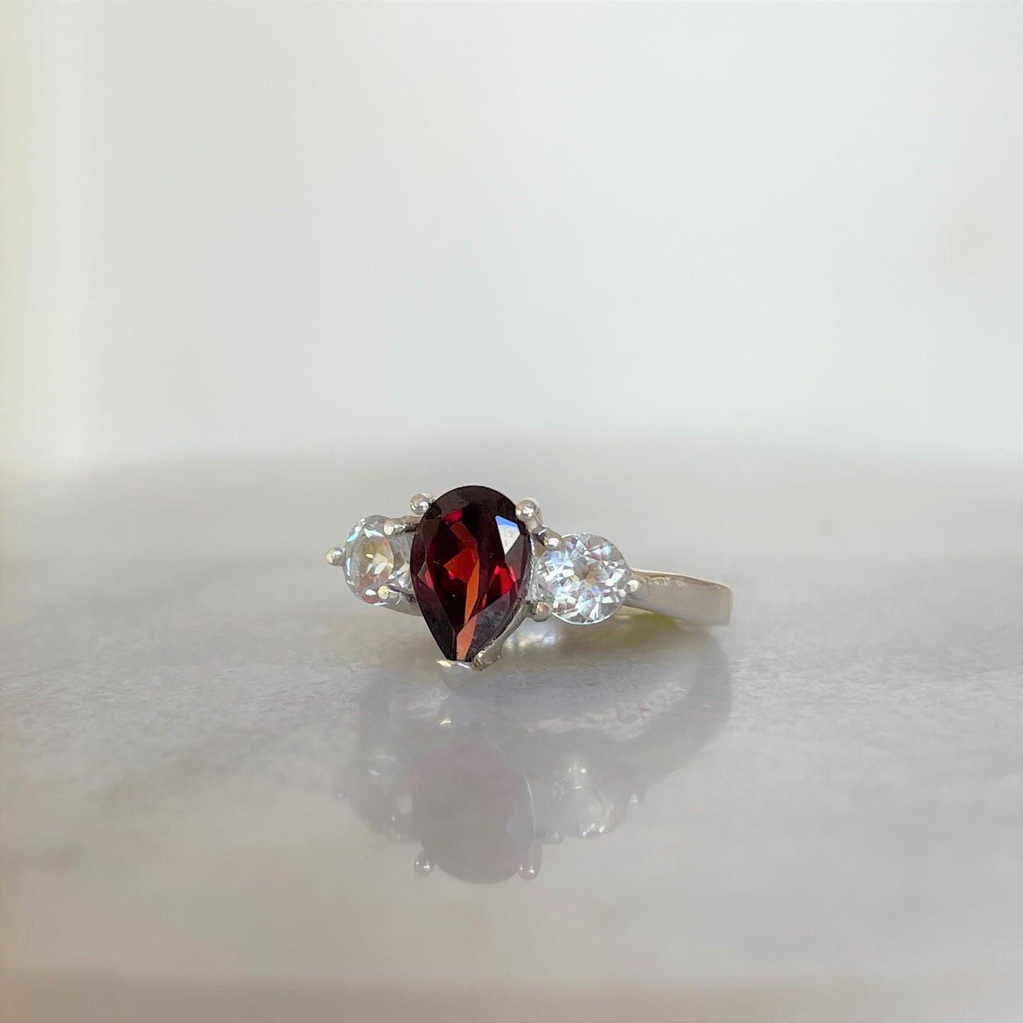 Garnet cluster ring side view