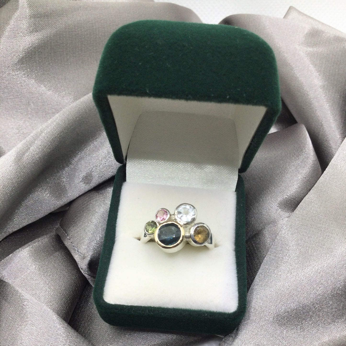 green and pink tourmaline cluster ring in box