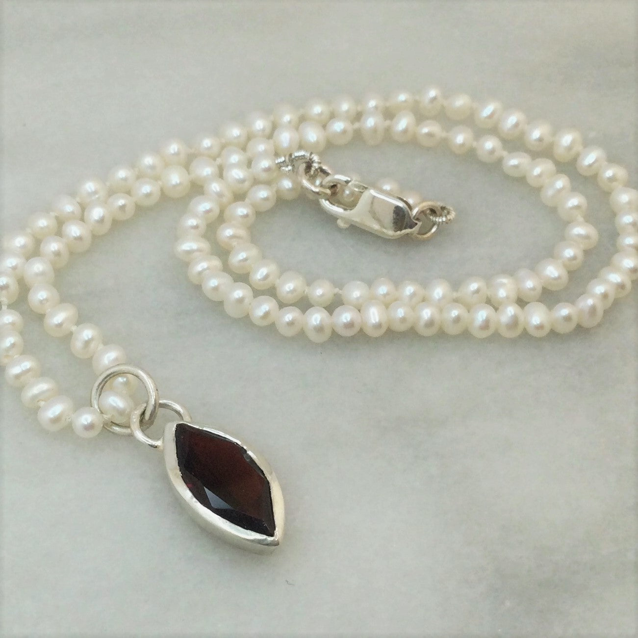 Dainty seed pearl and gemstone necklace
