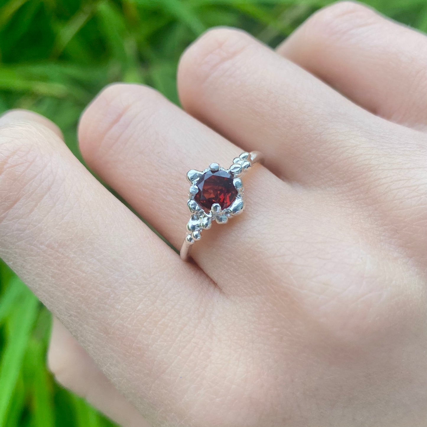 Garnet molten silver ring on model
