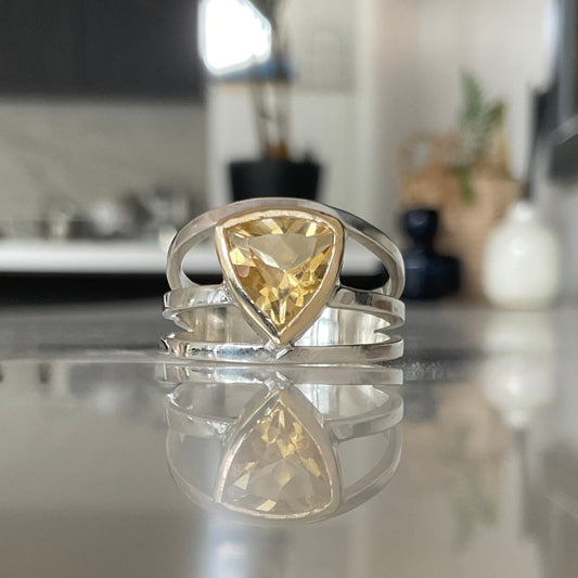 Trillion Citrine set in a touch of gold on a sterling silver three band ring