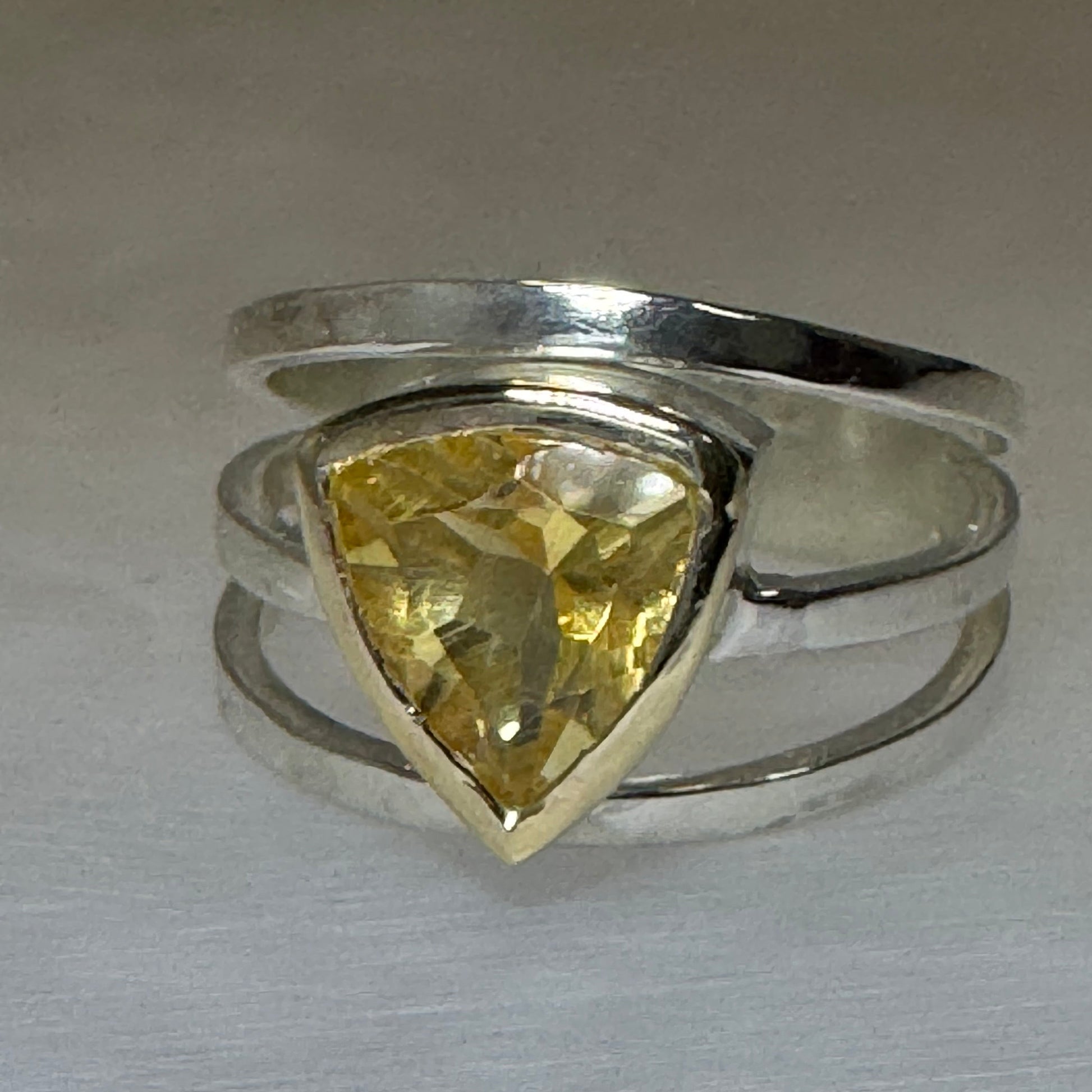 Three band silver cage ring with an 8mm trillion citrine