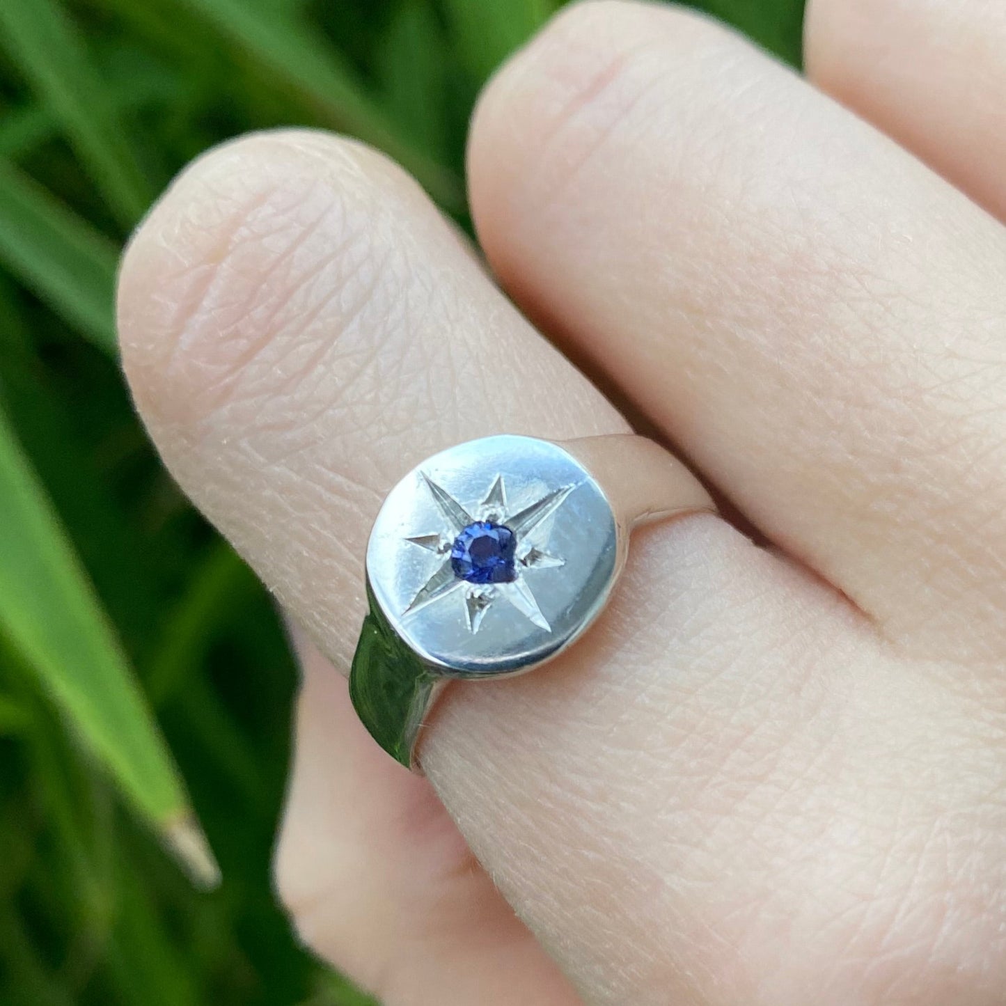 Silver signet ring with star set sapphire