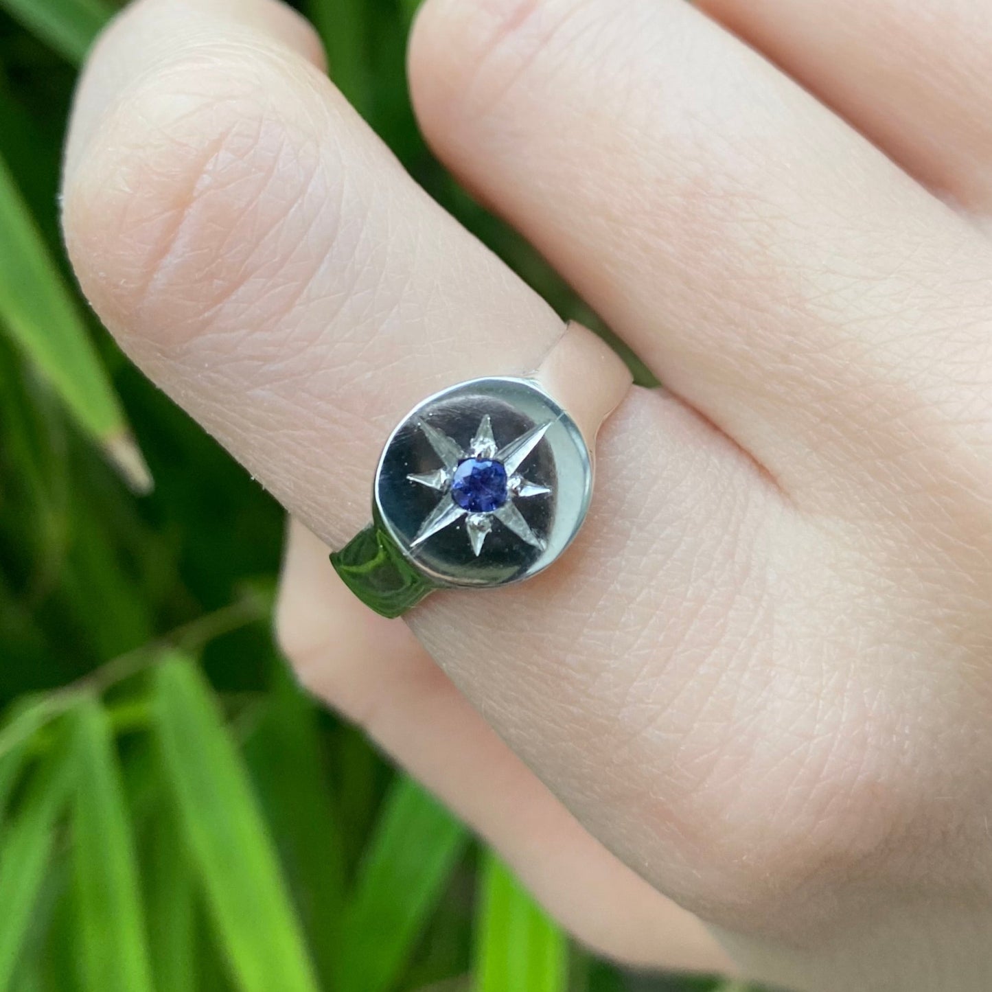 Signet ring shown on hand