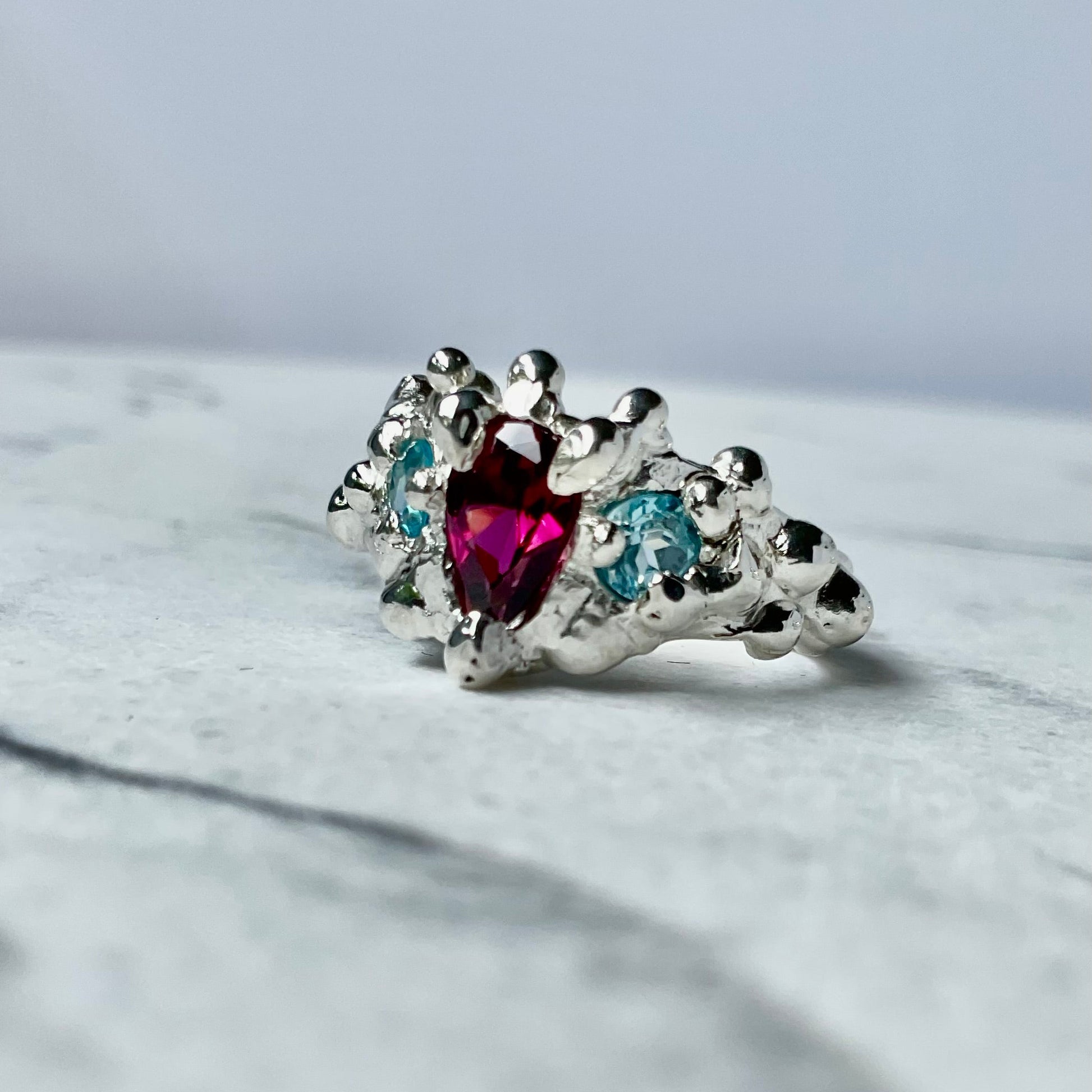 Pink garnet and swiss blue topaz silver molten ring