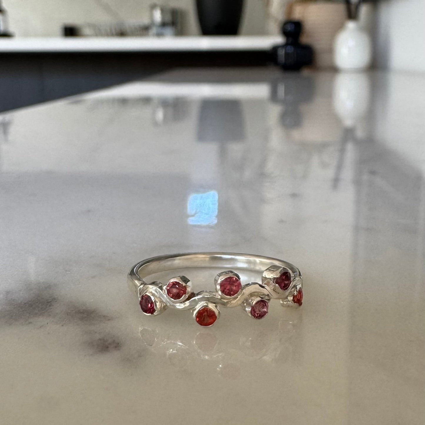 Sapphires set in wave ring band