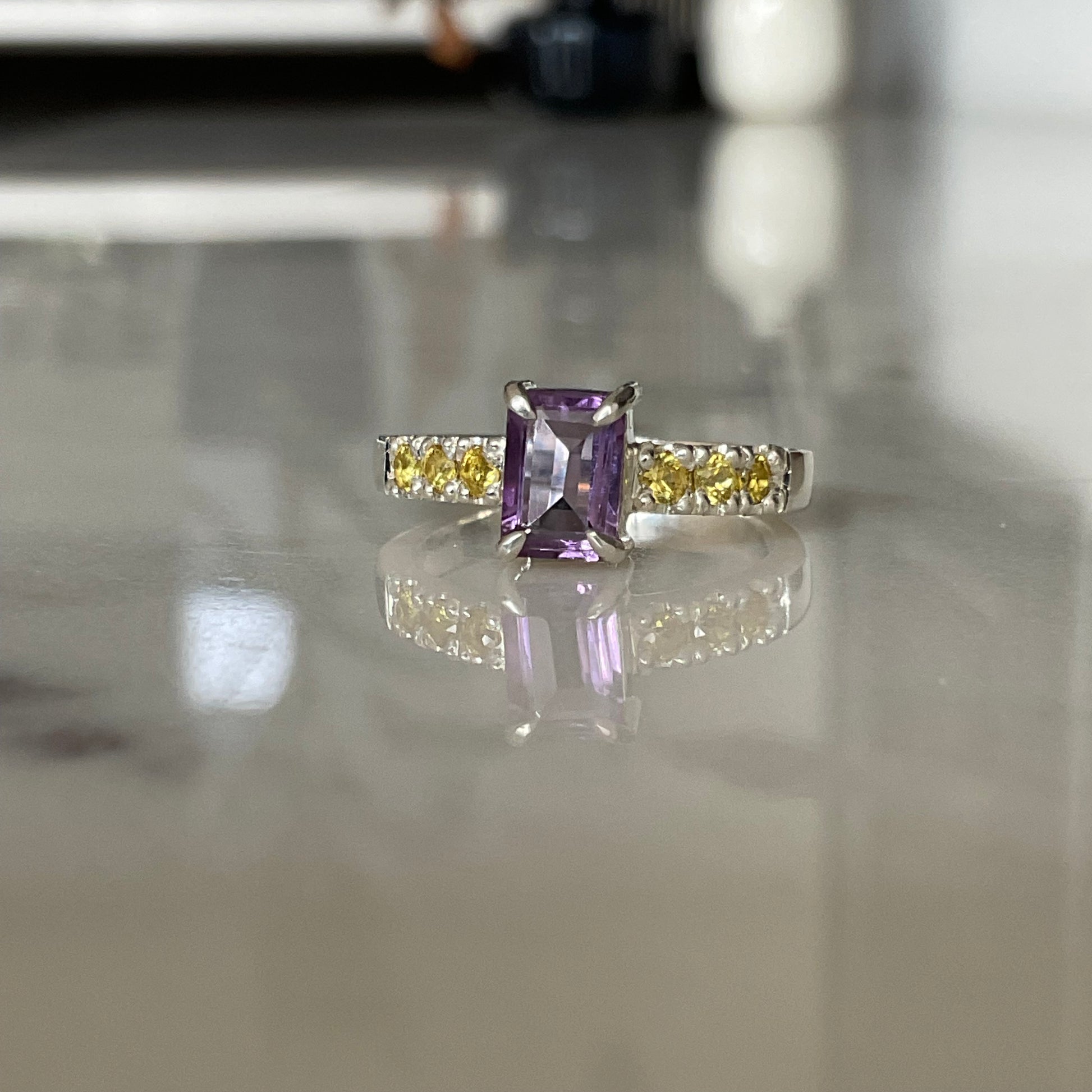 Sterling silver amethyst ring with yellow sapphires set into the ring band