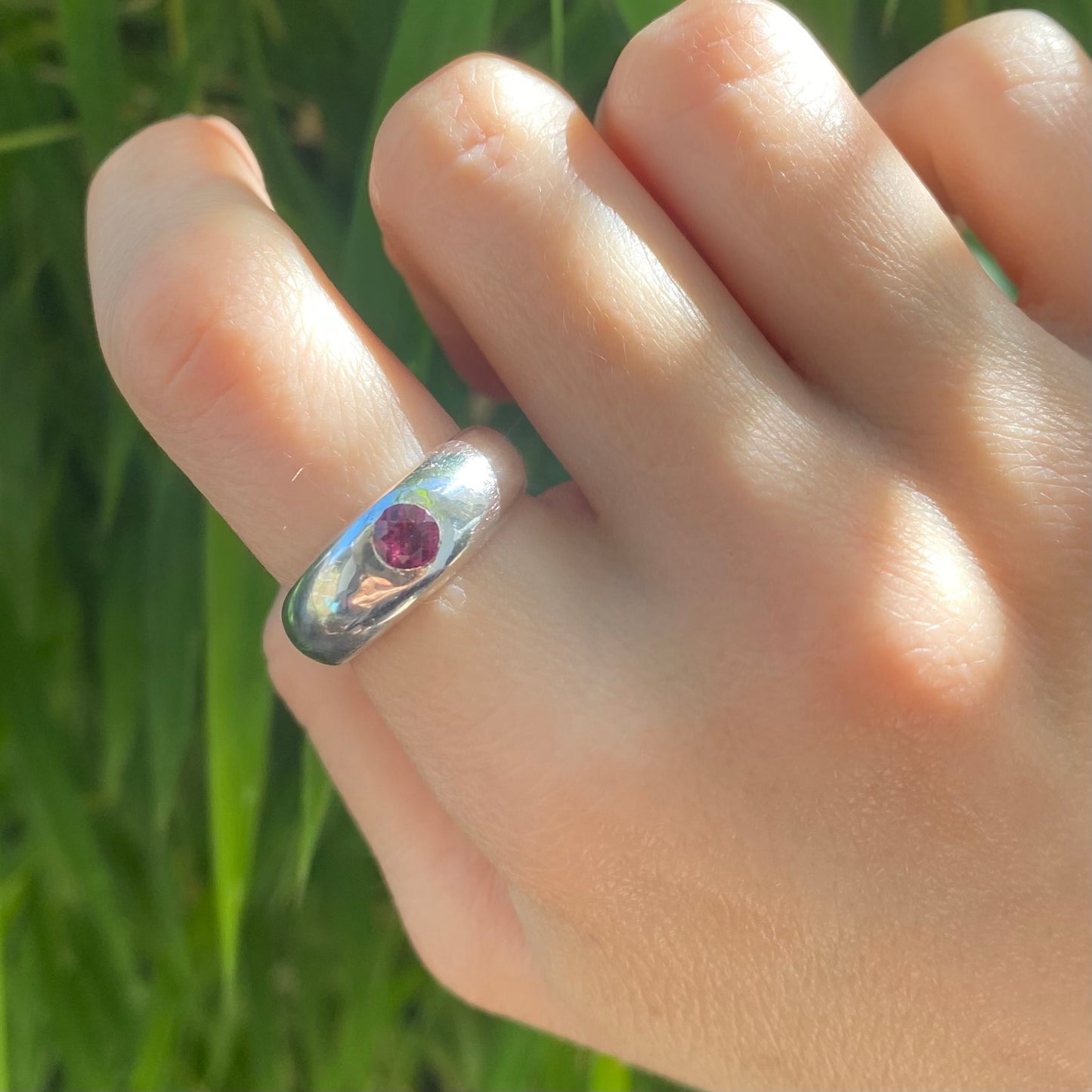Chunky silver ring shown in the sun light