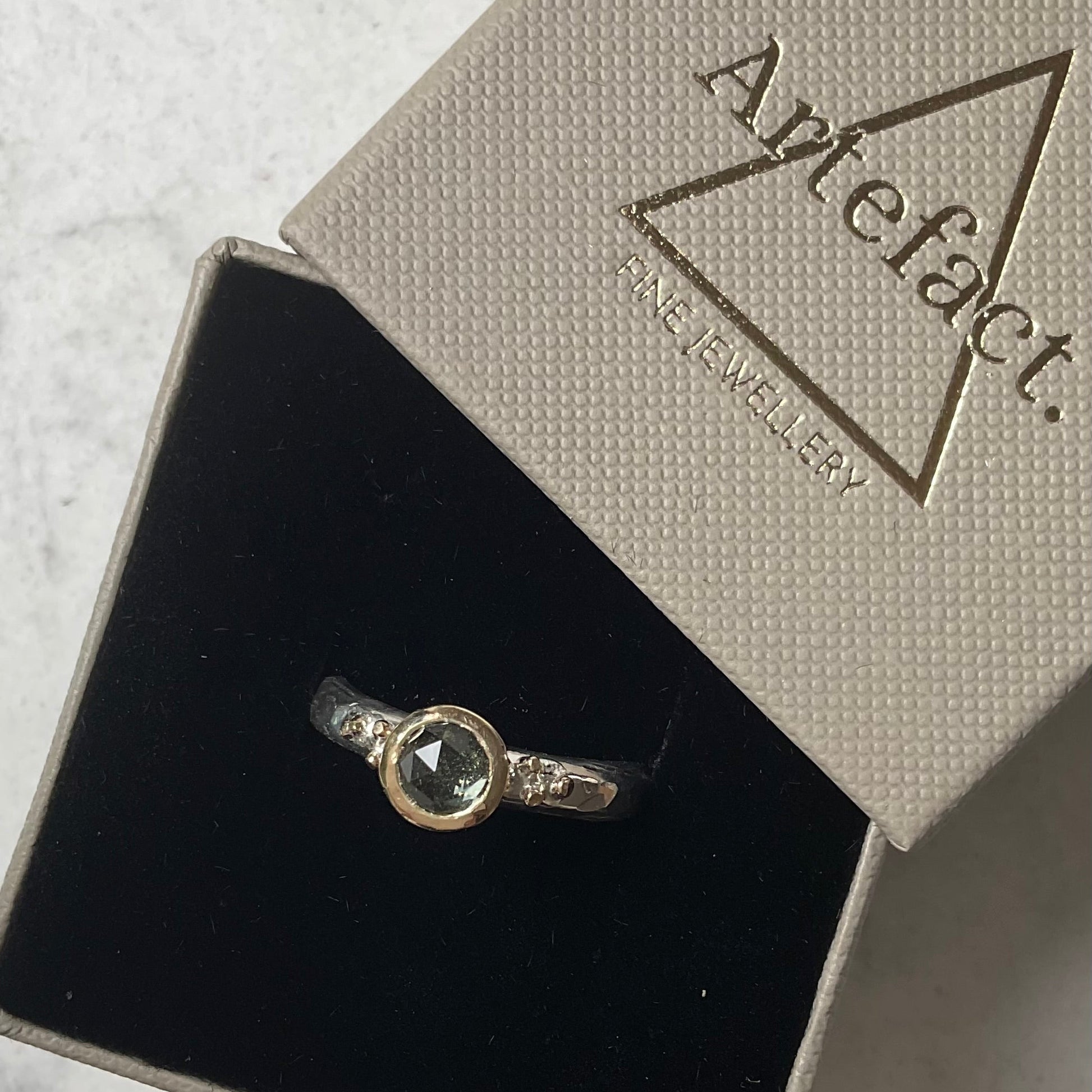 Prasiolite gemstone ring in a ring box