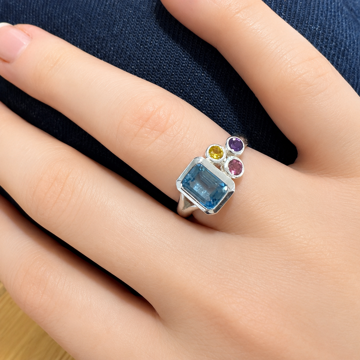 Rectangle Topaz cluster ring shown on hand
