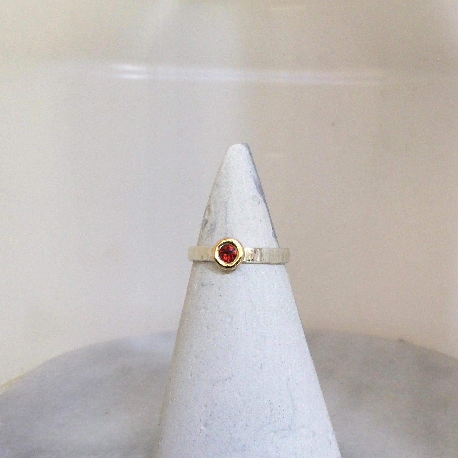 Mozambique garnet ring set on ring cone