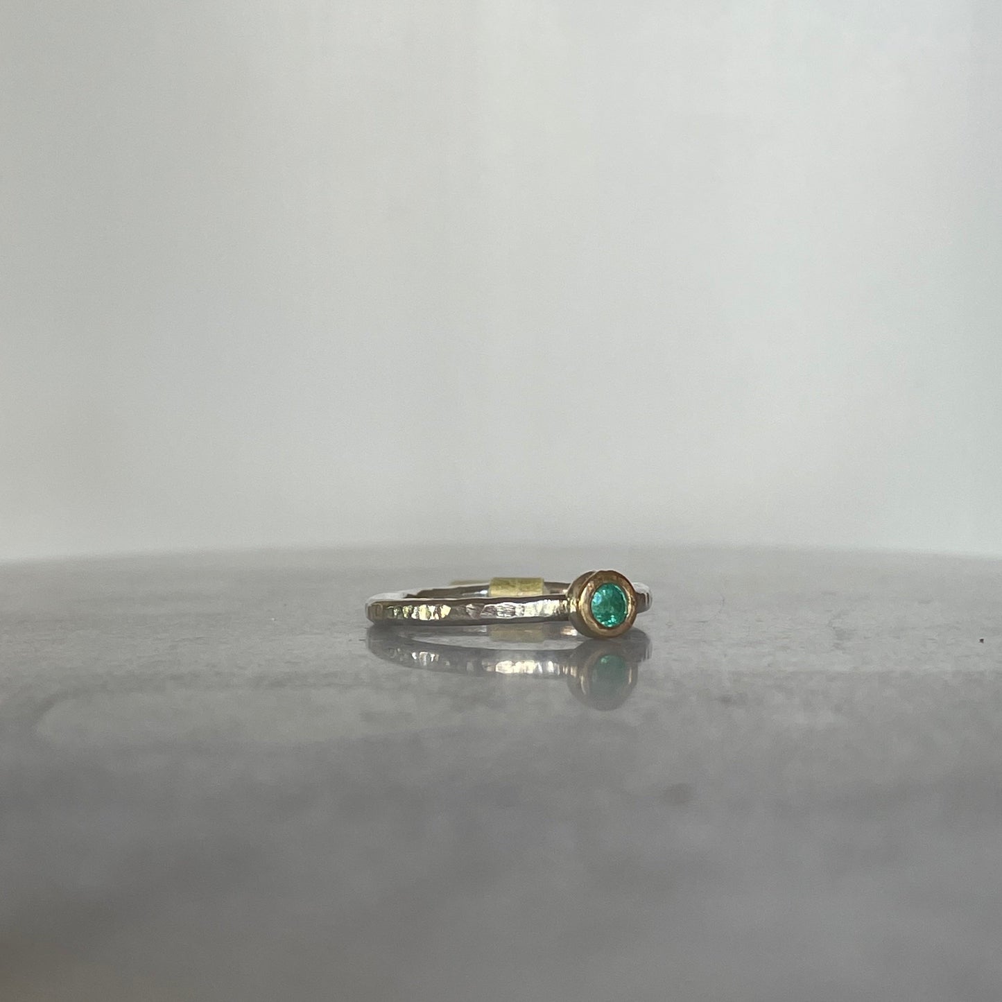 Emerald stacking ring in sterling silver and 9ct gold side view