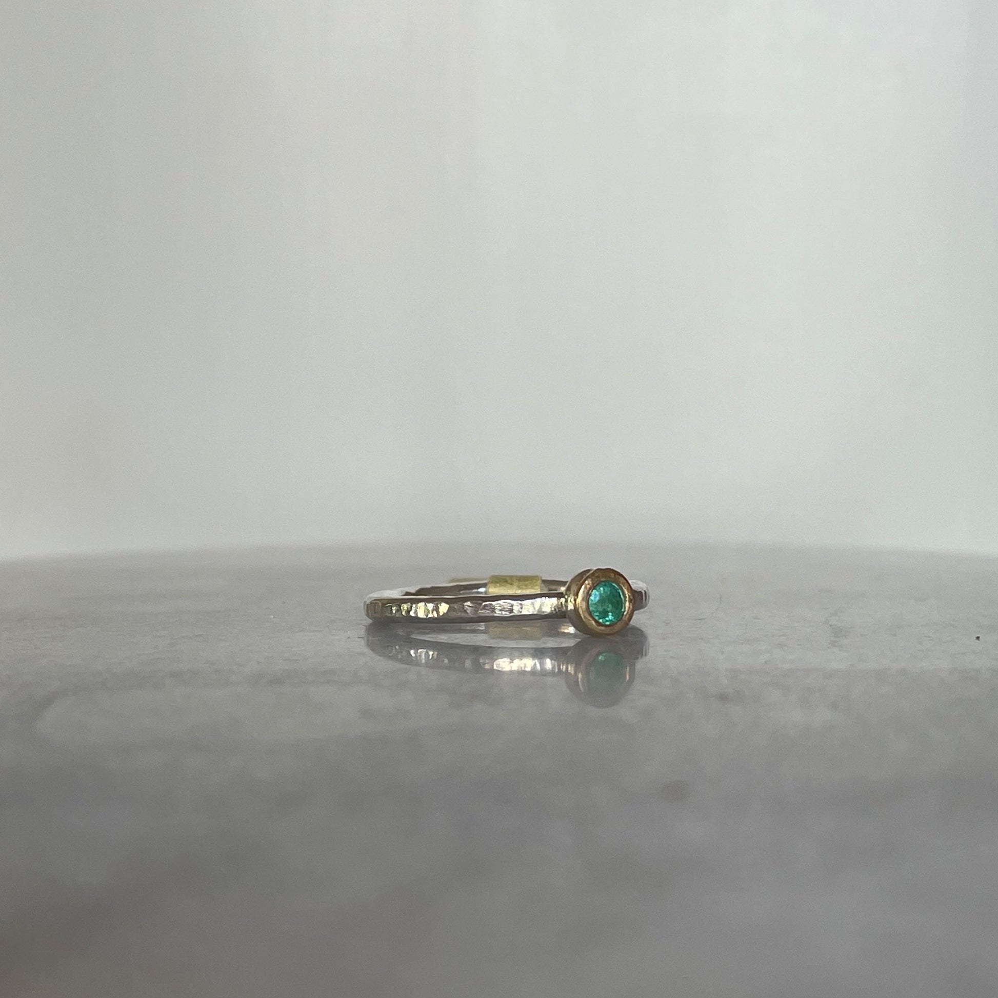 Emerald stacking ring in sterling silver and 9ct gold side view