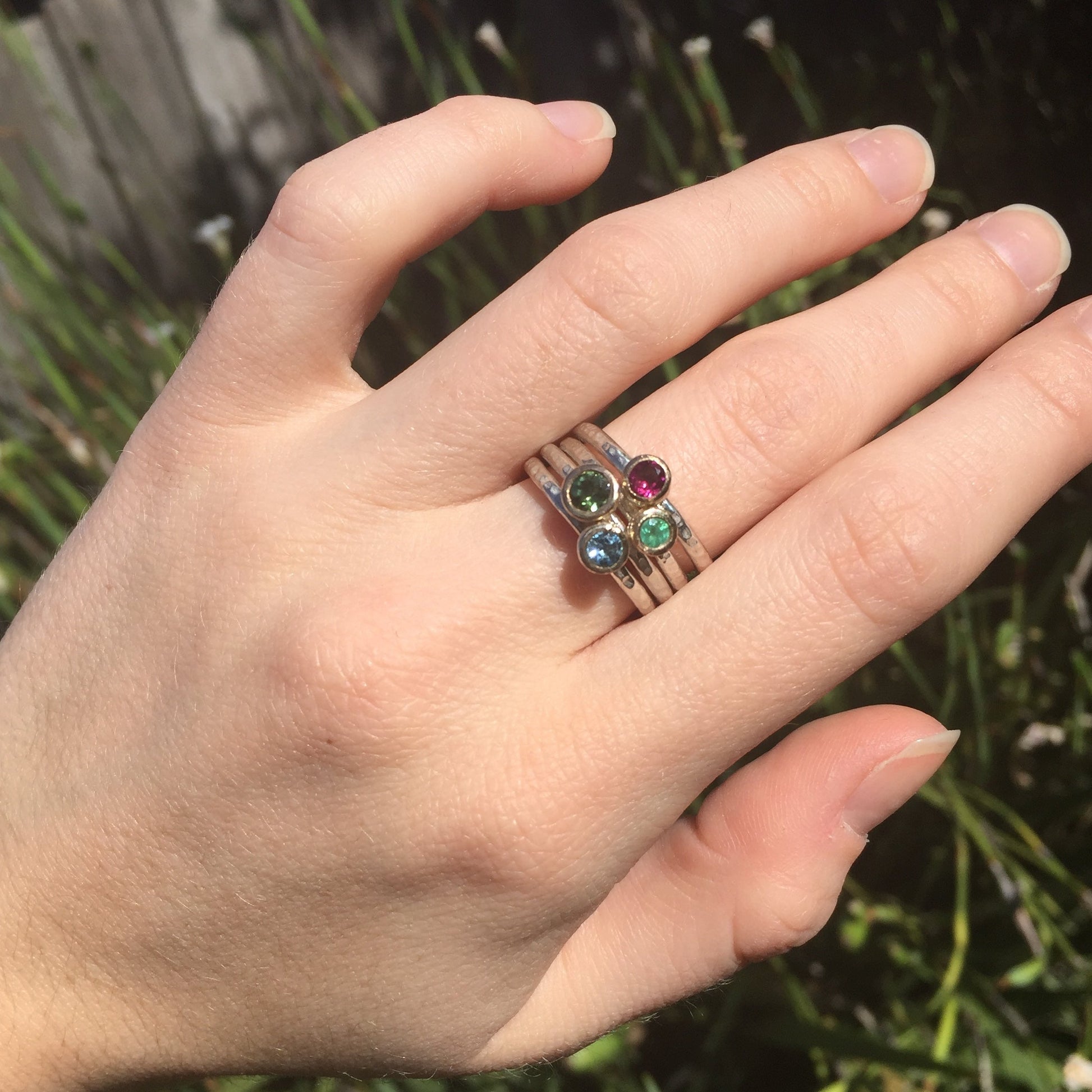 Gemstone stacking rings shown on model