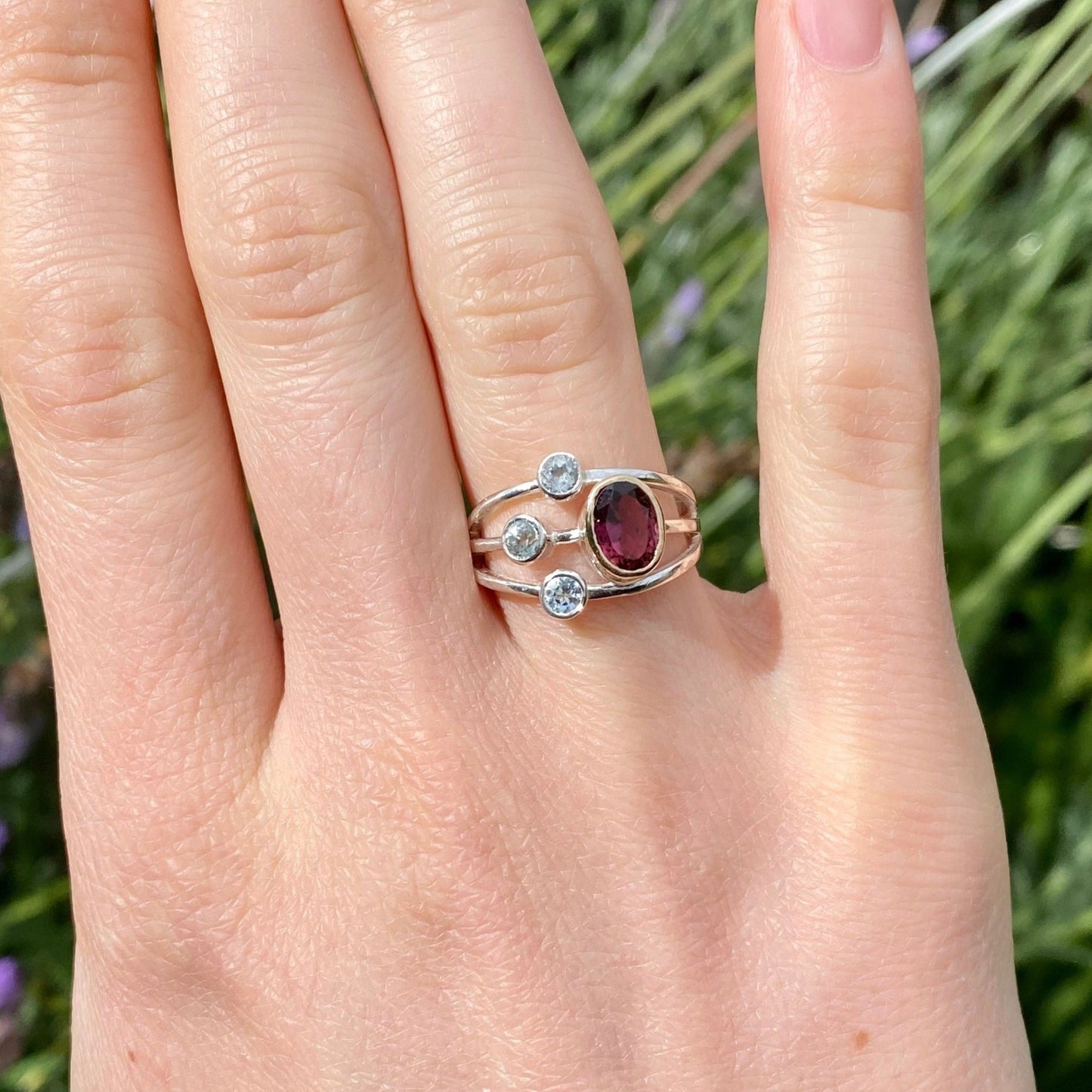 Pink tourmaline and aquamarine gemstone ring shown on model