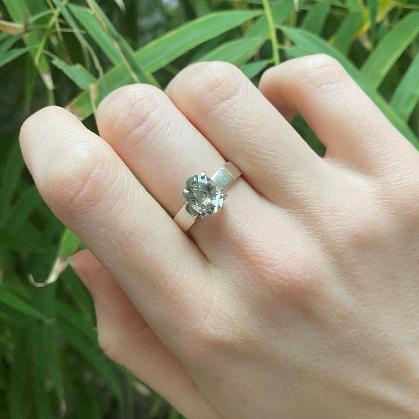green gemstone ring shown on model